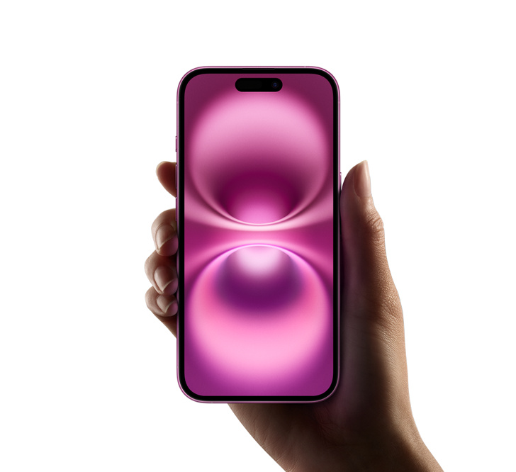 Hand holds iPhone 16 Pink