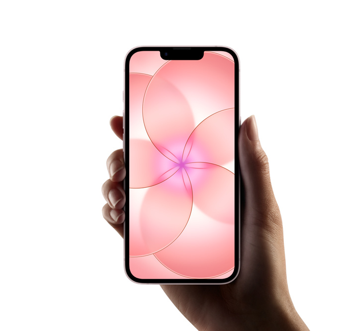 Hand holds iPhone 17e Soft Pink